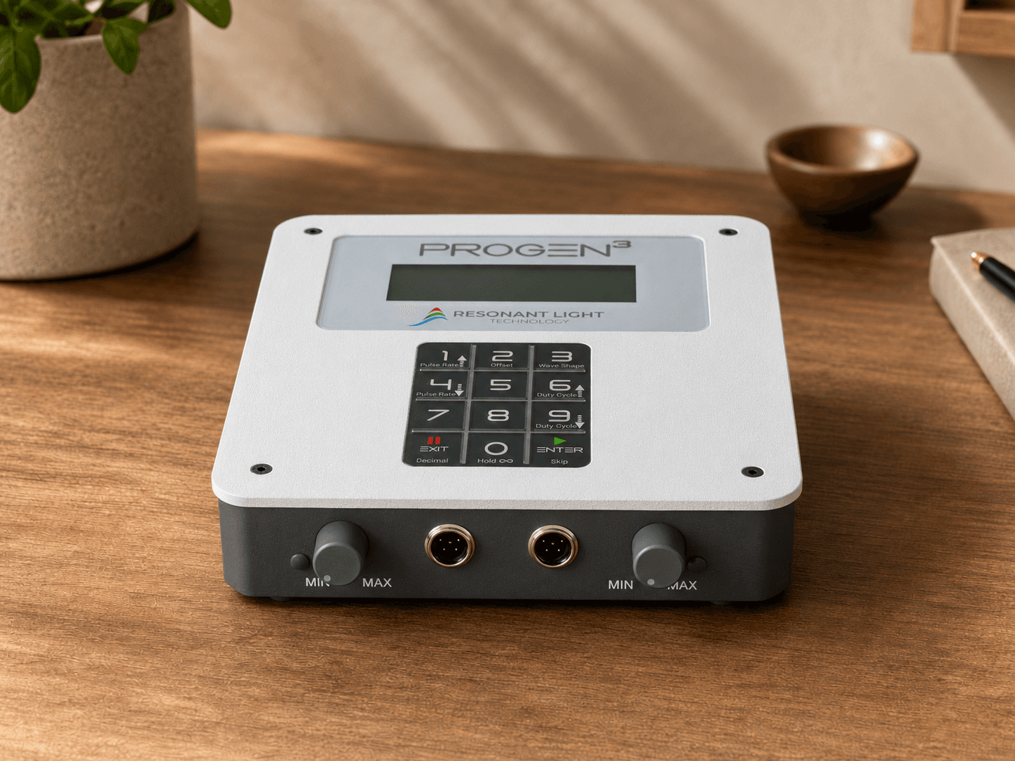 ProGen 3 frequency generator on a wooden desk